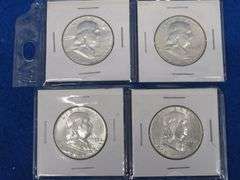 Four Franklin half-dollars
