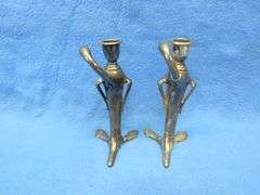 Pair of Art Nouveau era figural candlesticks.  Unknown composition.  Marked W. B. Mfg. Co. 1110.