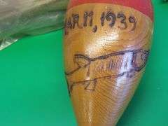 Hand carved wooden bobber and a vintage package of Deep Sea Hand Line