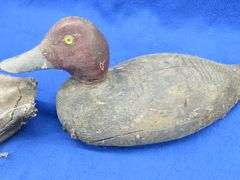 Two vintage duck decoys, one cork and one wooden with glass eyes