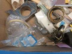 Clock parts including weights, extremely small screws, and more.