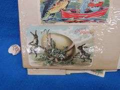 Two scrapbooks filled with postcards, greeting cards. tobacco cards, and more