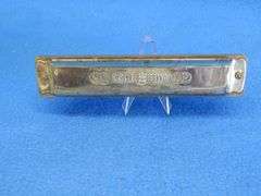 Johann Schrunk Castle Brand tremolo key of C harmonica with 20 holes.