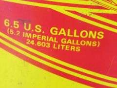 Vintage snowmobile Stancan 6.5 gallon steel gas can and a 6 7/8-7" Bell helmet.