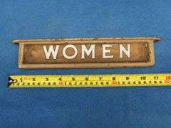 Vintage glass restroom signs in cast iron frames