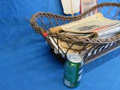 Antique wicker basket with an old Gluek's advertising fan, and Collector's Weekly and Antique monthl