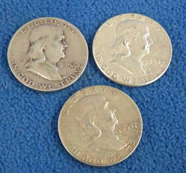Three Benjamin Franklin silver half-dollars