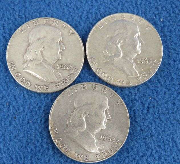 Three Benjamin Franklin silver half-dollars