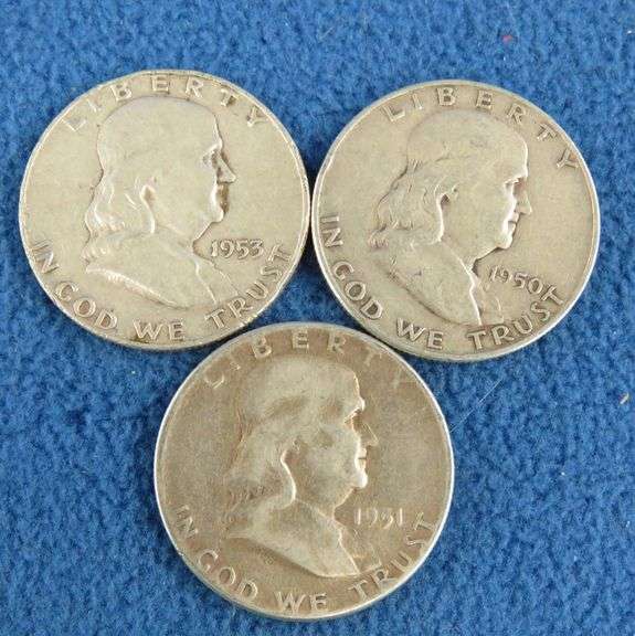 Three Benjamin Franklin silver half-dollars