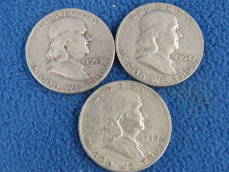 Three Benjamin Franklin silver half-dollars