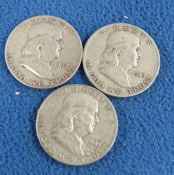 Three Benjamin Franklin silver half-dollars