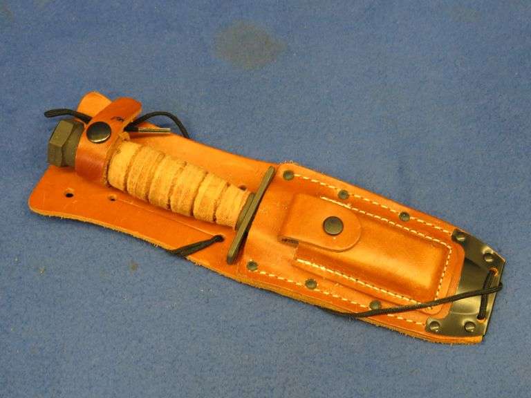 Military Pilot survival knife in a leather sheath
