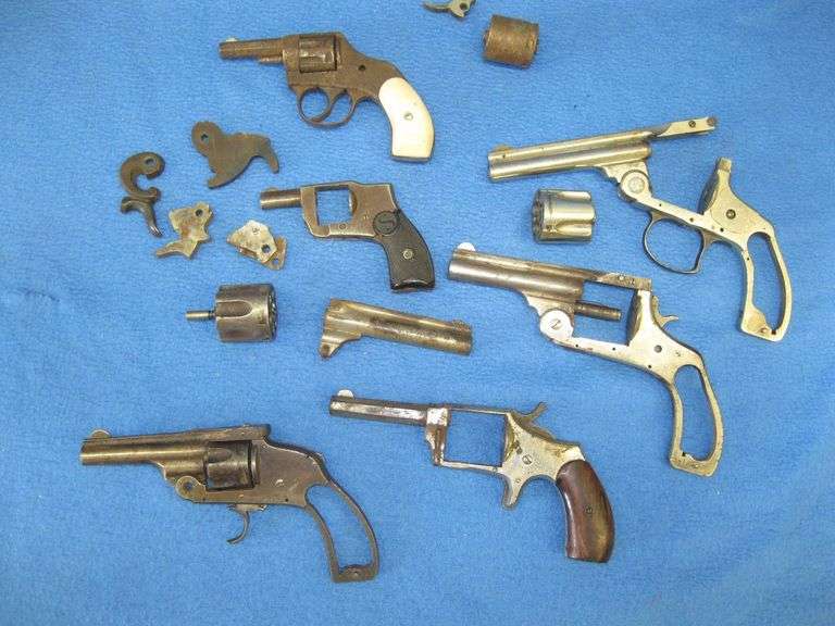 Six pistol frames with various parts and pieces.  Two Hopkins & Allen, two Harrington & Richardson, 