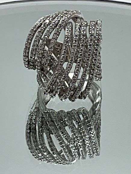 Silver and diamond simulant ring.