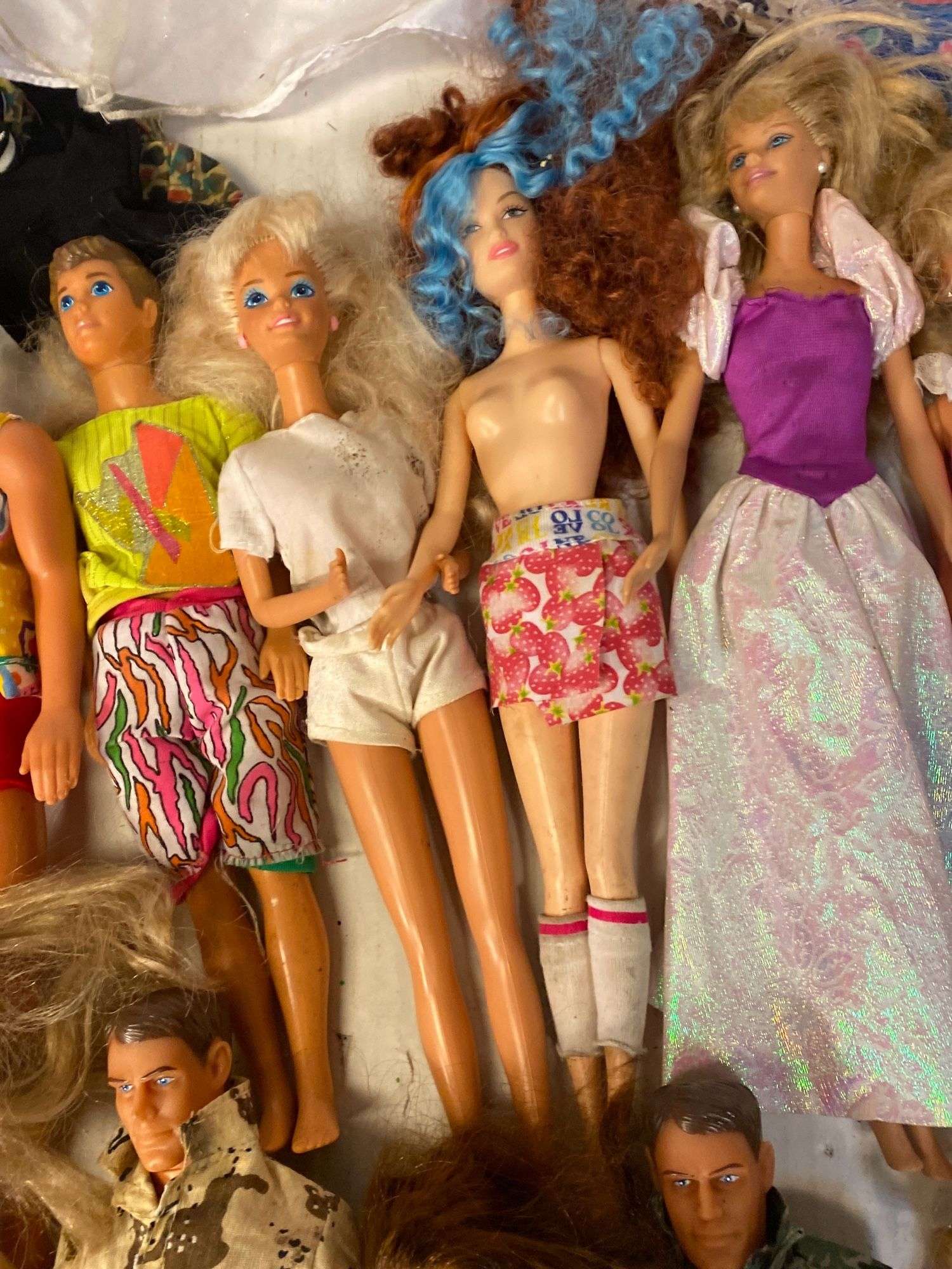 Well loved vintage Barbie, Ken, G.I. Joe dolls, clothes