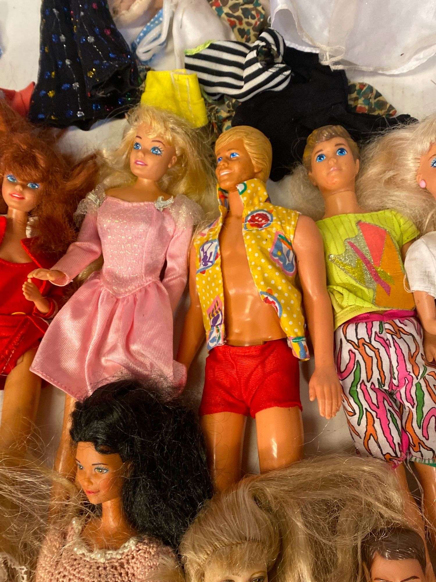 Well loved vintage Barbie, Ken, G.I. Joe dolls, clothes