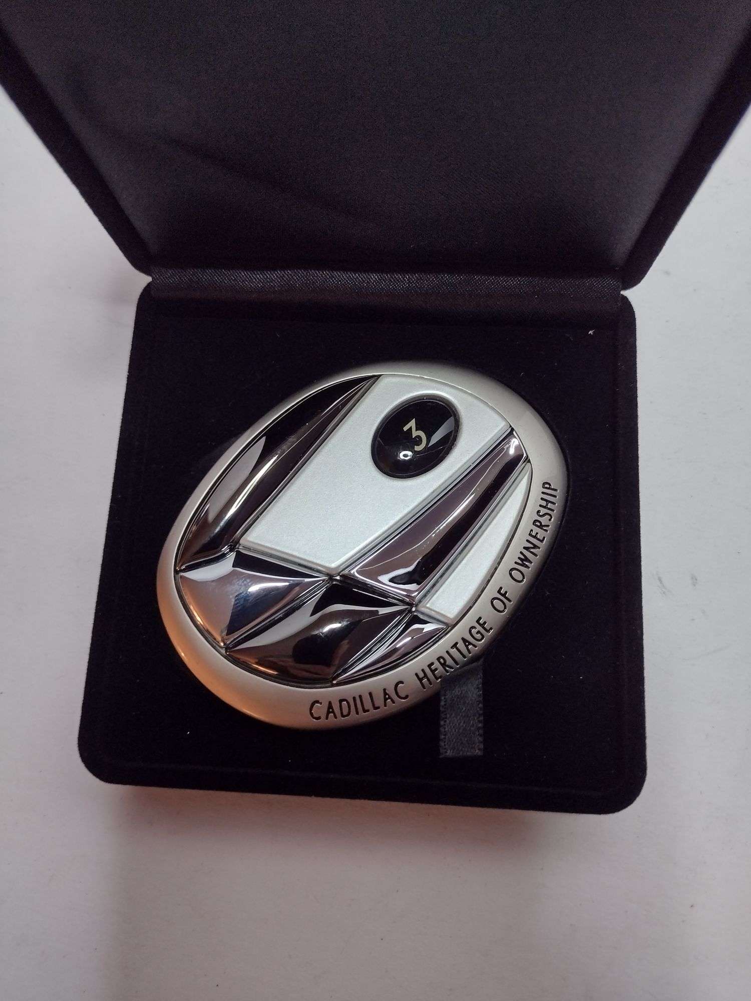 The heritage of ownership medallion from capital Cadillac