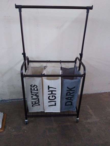 Laundry cart with adjustable  bar for hanging clothes .
