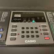 Electric Piano Casio CTK-650 in box . Comes with a stand but needs