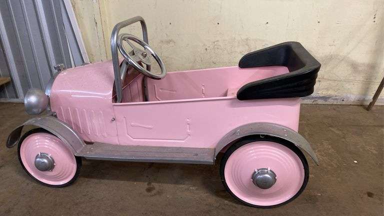 Pink metal pedal car in great condition (BIN $100)