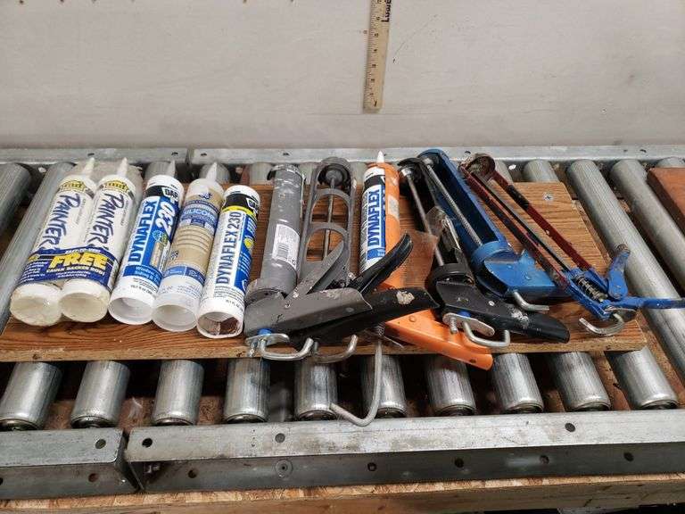 CAULK GUNS AND PRODUCT. 12B