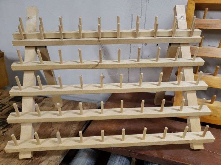 PAIR OF THREAD HOLDERS. 16D