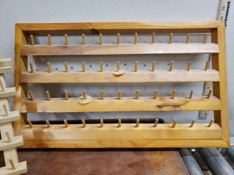 PAIR OF THREAD HOLDERS. 16D