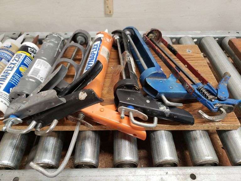 CAULK GUNS AND PRODUCT. 12B