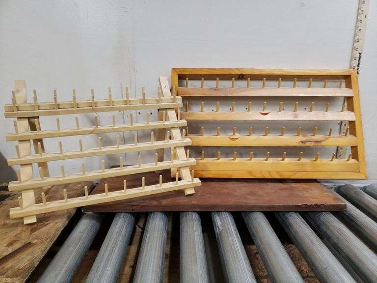 PAIR OF THREAD HOLDERS. 16D