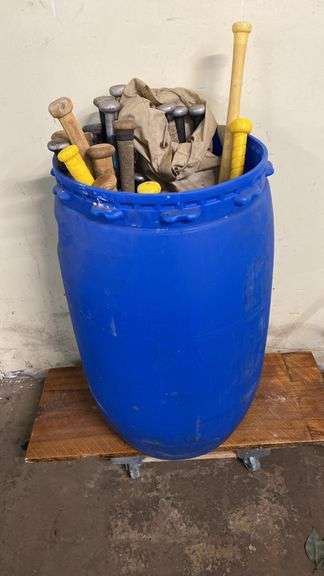 Barrel full of baseball bats – plastic, wood and aluminum