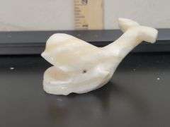 DECORATIVE POLISHED CARVED STONE WHALE FIGURINE. DC