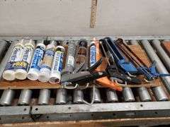 CAULK GUNS AND PRODUCT. 12B