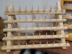 PAIR OF THREAD HOLDERS. 16D