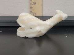 DECORATIVE POLISHED CARVED STONE WHALE FIGURINE. DC