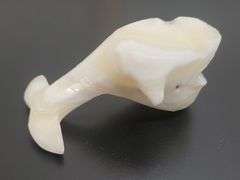DECORATIVE POLISHED CARVED STONE WHALE FIGURINE. DC