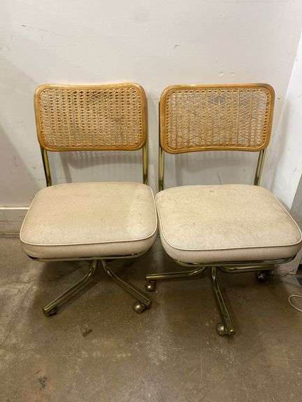 Pair of matching dining chairs on wheels
