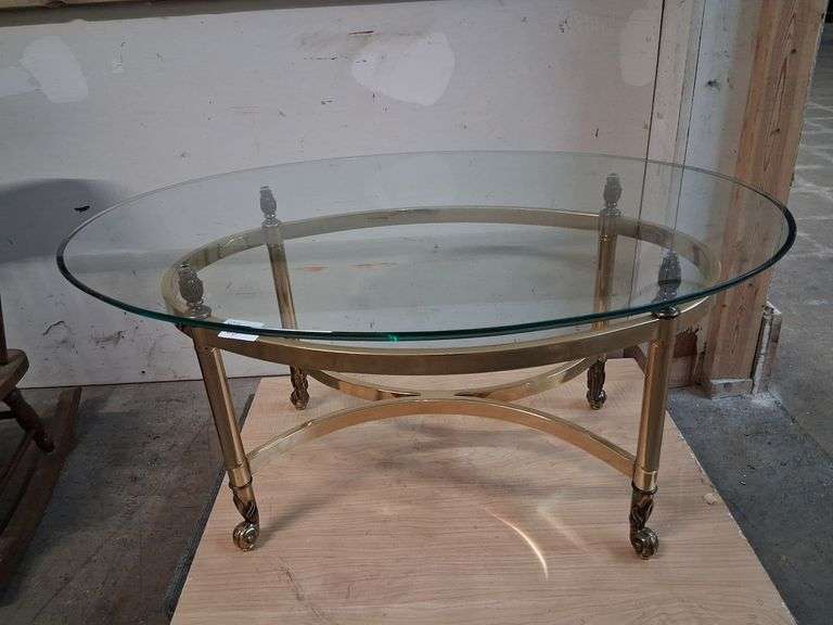 Glass top gold tone coffee table