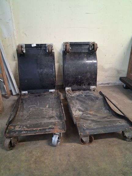 4 metal vehicle dollies, 1 has bent wheel