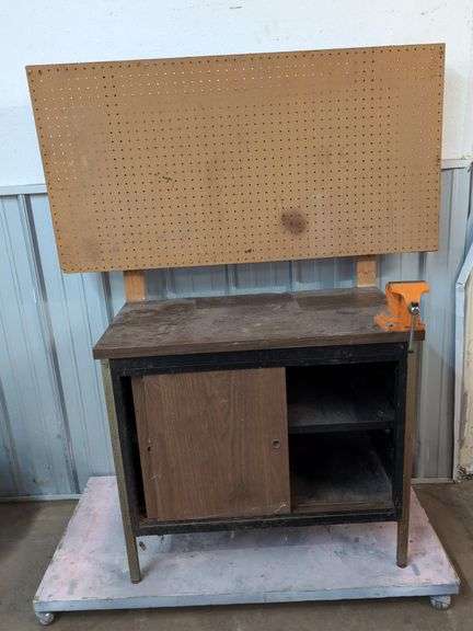 Cabinet turned workbench with pegboard and vice 48" x 22"