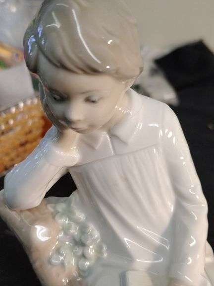 Lladro child in chair figurine