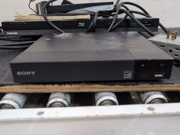 Variety of electronics, including Blu-ray player. 2d