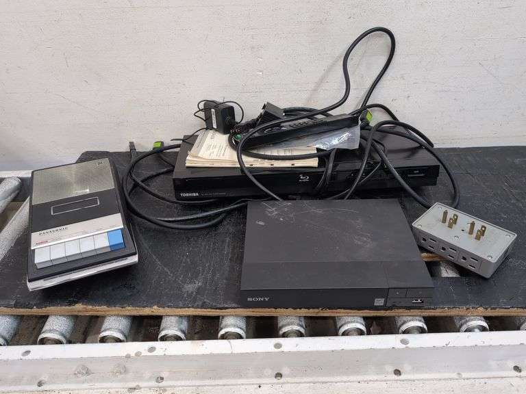 Variety of electronics, including Blu-ray player. 2d