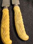 1930 Frary & Clark yellow cellidoid handles knives, forks & serving set 26 pieces