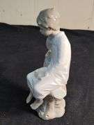 Lladro child in chair figurine