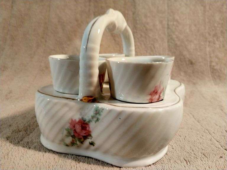 Vintage egg cups with a matching basket. Germany. I950's.