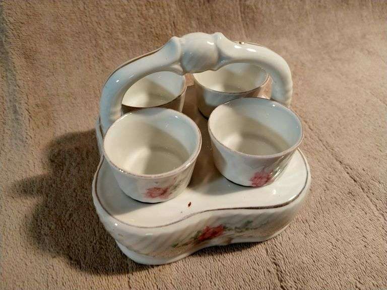 Vintage egg cups with a matching basket. Germany. I950's.