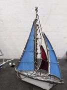 Pair of metal and glass sailboat figures. 2d