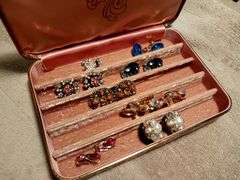 Vintage earrings in a vintage jewelry box.