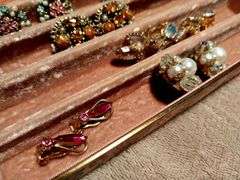 Vintage earrings in a vintage jewelry box.