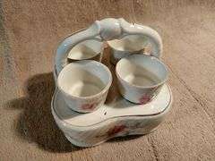Vintage egg cups with a matching basket. Germany. I950's.